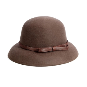 Elegant brown wool cloche hat with a decorative bow for women in a vintage autumn style