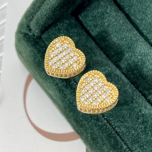Exquisite 18k gold plated heart stud earrings with white cubic zirconia on green velvet