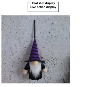 Detail of hanging Halloween gnome with purple striped hat and long white faux fur beard