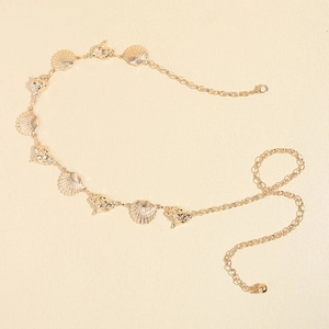 Detail of golden metal waist chain with starfish shells and adjustable lobster clasp