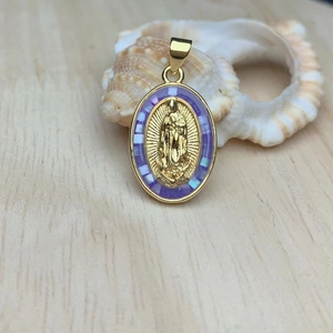Oval Virgin of Guadalupe pendant with gold finish and purple shell inlay border