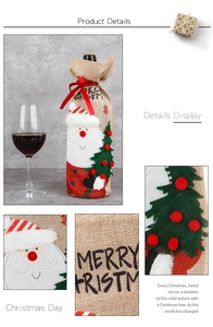 Close-up of burlap wine bag with 3D Santa, Christmas tree and embroidered Merry Christmas