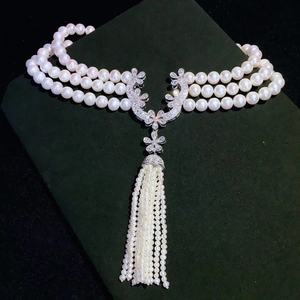 Three-layer pearl choker necklace with zirconia floral pendant and tassel drop