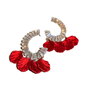 Elegant gold C-shape earrings featuring red flower petals and sparkling zircon stones