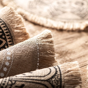 Japanese style hand-woven jute placemat with tassels and geometric print pattern