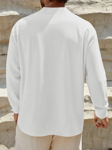 Outdoor back view of men's white linen short sleeve shirt with stand collar