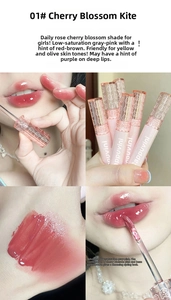 Detailed close-up showing 01 Cherry Blossom Kite lip glaze texture and cat-themed packaging