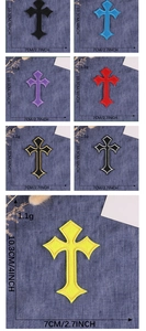 Detail view of gothic cross embroidered patches in multiple colors and precise dimensions
