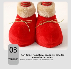 Close-up of red velvet Christmas elf boots with beige faux fur trim and gold bows