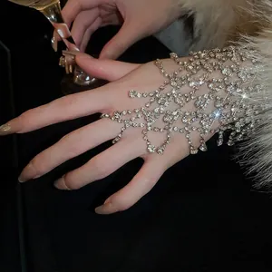 Elegant silver layered tassel hand chain with rhinestones covering back of hand