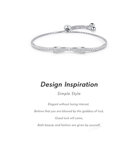 Detail of 925 sterling silver bow bracelet with sparkling cubic zirconia pavé and box chain