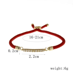 Adjustable red braided rope bracelet with gold-plated bar and micro-pave crystals