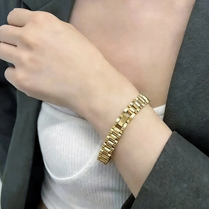 Elegant gold stainless steel watch-strap style bracelet for men and women in casual attire