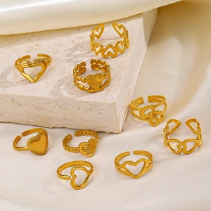 18K gold plated stainless steel heart rings set with Love You engraving on silk backdrop
