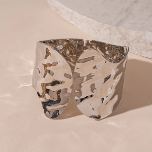 Detailed view of wide liquid metal wavy cuff bracelet with silver polished texture