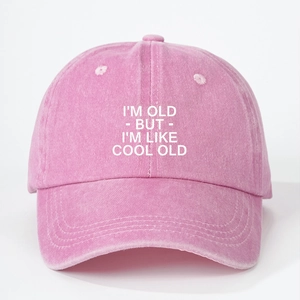 Pink washed cotton baseball cap with I'M OLD BUT I'M LIKE COOL OLD printed slogan