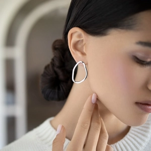 Minimalist S925 sterling silver irregular geometric earrings shown on female model