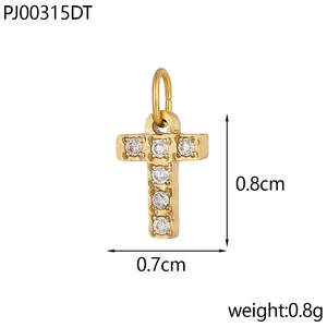 Detail of a small gold cross pendant with clear cubic zirconia diamonds, 0.8cm by 0.7cm size