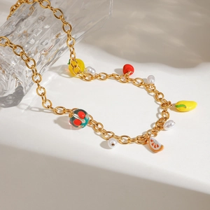 Golden stainless steel necklace with pearls and colorful fruit charms like lemon and mango