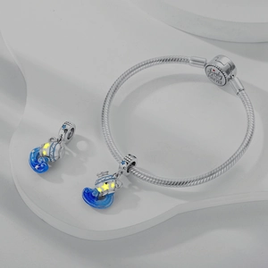 Silver Aquarius zodiac charm bracelet with blue enamel stars and engraved snake chain