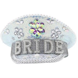 Detail of white sequin captain hat featuring pearl BRIDE lettering and rhinestone floral