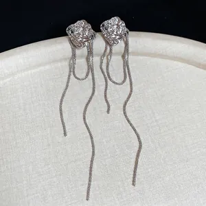 Elegant irregular flower tassel drop earrings in silver finish with long metal chains