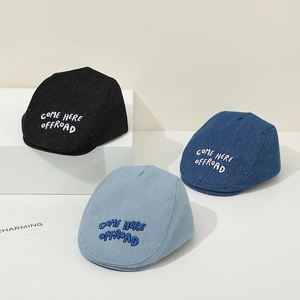 Three colors of denim baby beret hats with COME HERE OFFROAD embroidery on white podiums