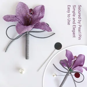Elegant purple fabric lily boutonniere with a pearl pin for formal wedding suit attire