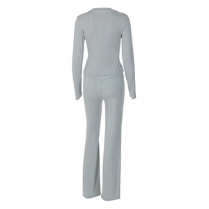 Detail view showing the back fit of a grey long-sleeve top and flared trousers set
