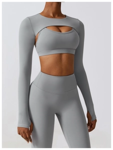 Detailed view of high-waist yoga set with thumbhole sleeves and athletic bra in gray