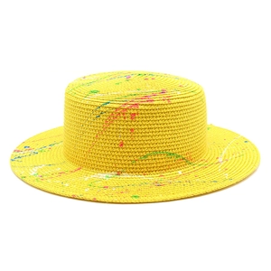 Artistic graffiti straw boater hat with colorful paint splatters and a flat top crown