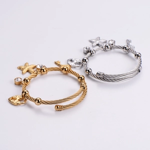 Marine stainless steel cable bracelets with starfish, heart and key charms in gold and silver