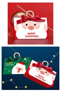 Detail of Christmas gift boxes with ribbons and Merry Christmas text in festive scenes