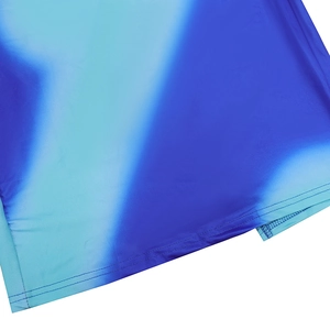 Detail shot of blue gradient fabric texture with neat double-needle stitching on the hem