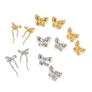 Ensemble de boucles d'oreilles papillon en or 18 carats et argent avec zircons brillants