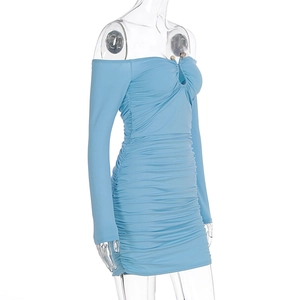 Close-up of light blue off-shoulder ruched dress with metal ring and long sleeves