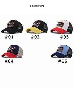 Detail view of five mesh trucker hats with fish patches and contrast stitching