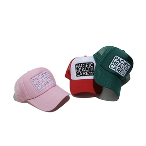 Three colorful vintage trucker hats with Pacific embroidery shown from a top view