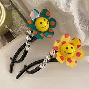 Detail view of flower-shaped hair clips featuring vibrant polka dots and smiley faces