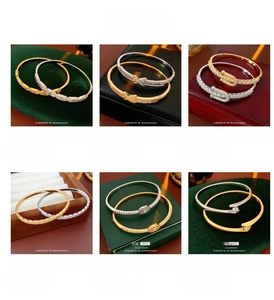 Collage of gold-plated bracelets featuring crossover, oval, and zircon-encrusted designs