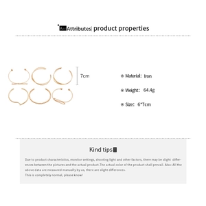Detail of 6-piece golden iron open bangle set with various spiral and bead designs
