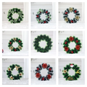 Artificial Christmas wreaths set with pine needles berries and Merry Christmas ornaments