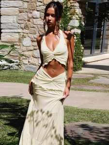 Beige two-piece summer set with deep V-neck halter crop top and ruffled tiered maxi skirt