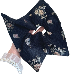 Classic Chinese jacquard scrunchie in deep blue floral pattern for elegant hairstyling