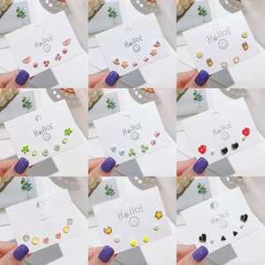 Detail view of 3x3 grid display featuring assorted fruit and heart shaped stud earrings