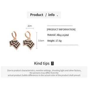 Detail showing geometric V-shaped earrings with rhinestones and size dimensions