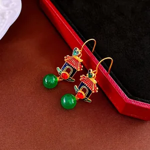 Classic Chinese palace style gold heart pagoda earrings with enamel and green bead charms