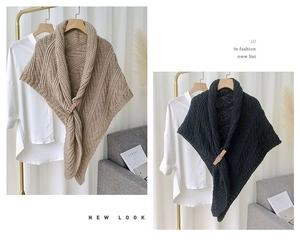 Detailed knit texture and leather buckle closure on stylish triangle shawl cardigans