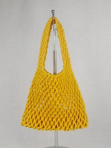 Handmade yellow woven mesh tote bag with wide handles and hollow diamond pattern