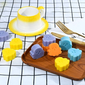 Halloween silicone molds with ghost and skull designs for DIY resin or baking on a tray
